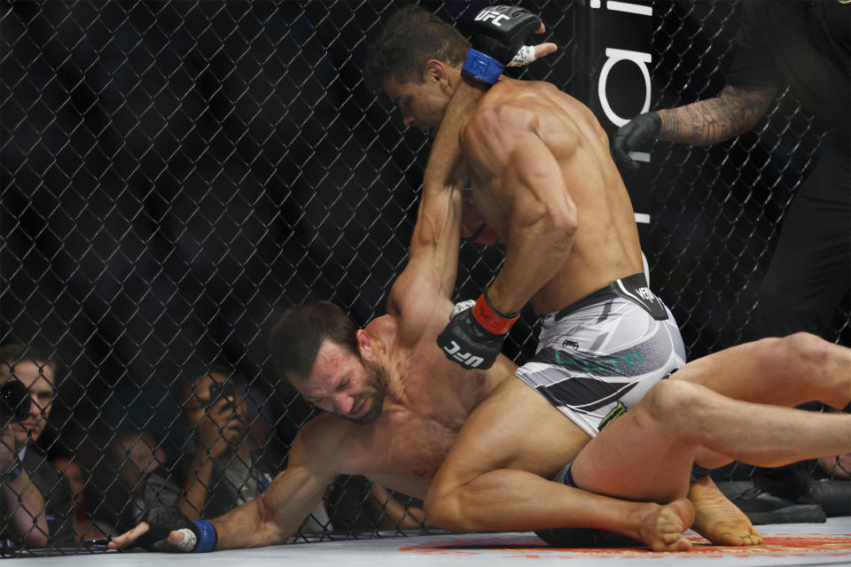 Aug 20, 2022; Salt Lake City, Utah, USA; Paulo Costa (red gloves) fights Luke Rockhold (blue gloves) during UFC 278 at Vivint Arena. Mandatory Credit: Jeffrey Swinger-USA TODAY Sports