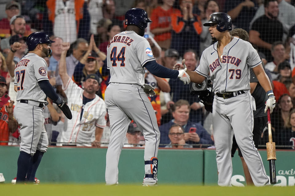 Houston Astros' Yordan Alvarez (44) celebrates after his three-run home run with Jose Abreu (79) and Jose Altuve (27) as he returns to the dugout in the sixth inning of a baseball game against the Boston Red Sox, Monday, Aug. 28, 2023, in Boston. (AP Photo/Steven Senne)