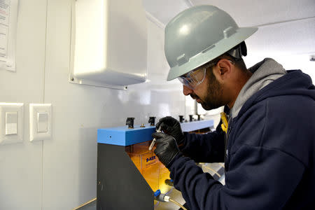 Amrat Gandhi demonstrates the separation process at a produced water recycling facility owned by Exxon near Carlsbad, New Mexico, U.S. February 11, 2019. Picture taken February 11, 2019. To match Insight USA-SHALE/MAJORS . REUTERS/Nick Oxford