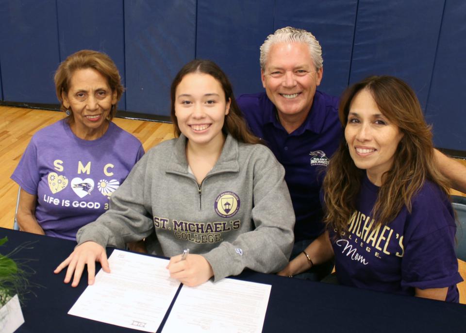 Sophia Underfer of Indian Hills commited to Saint Michael's College for softball. Also shown are her grandmother Ana Lara and parents John Underfer and Amparo Underfer.