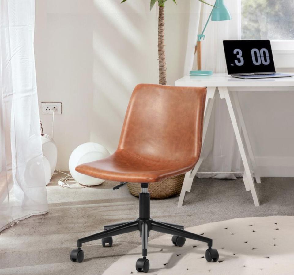 Make your meetings run smoothly with this leather office chair that features a padded backrest and seat so you're comfortable. It has five legs for when you feel like moving around throughout the day and a lever to adjust the height as well. <a href="https://fave.co/2J3AKcB" target="_blank" rel="noopener noreferrer">Originally $122, get it now for $90 at The Home Depot</a>.