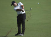 Italy's Francesco Molinari plays a shot on the 1st hole during the first round of the DP World Tour Championship golf tournament in Dubai, United Arab Emirates, Thursday, Nov. 15, 2018. (AP Photo/Kamran Jebreili)