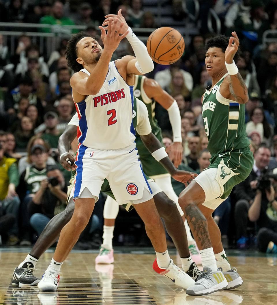 Pistons guard Cade Cunningham loses the ball to Bucks forward MarJon Beauchamp during the first half Saturday night at Fiserv Forum.