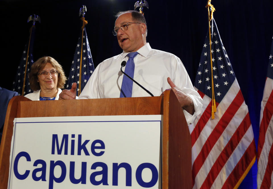 Rep. Michael Capuano, as his wife Barbara listens at left, concedes defeat to Boston City Councilor Ayanna Pressley in the 7th Congressional House Democratic primary, Tuesday, Sept. 4, 2018, at his primary night party in Somerville, Mass. (AP Photo/Elise Amendola)