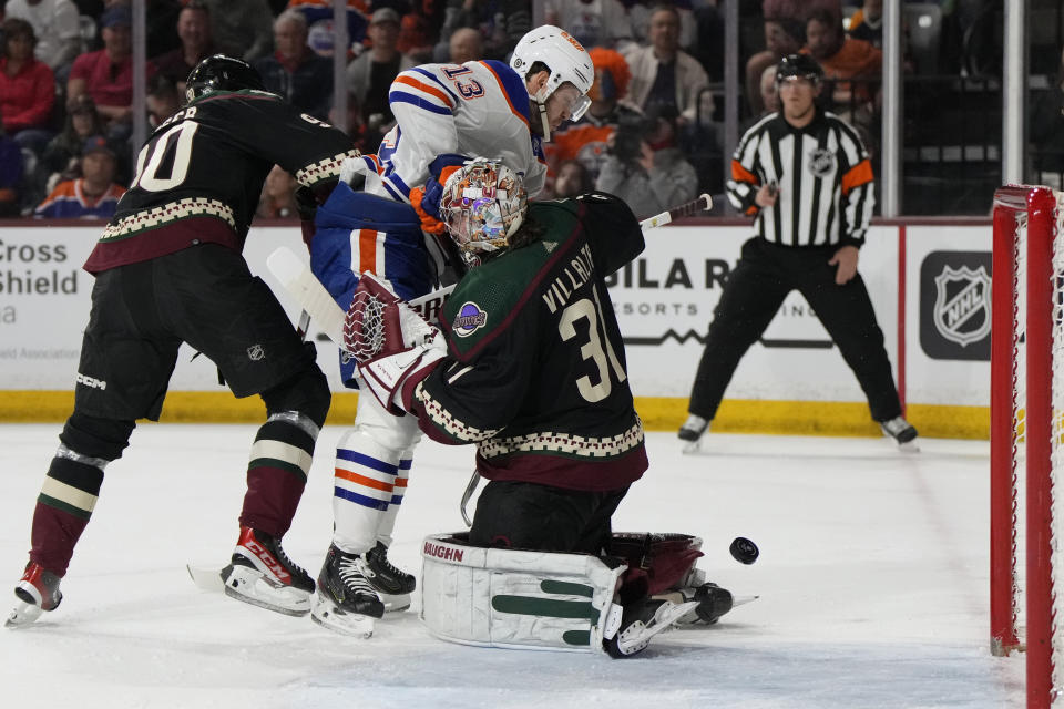 Edmonton Oilers center Mattias Janmark (13) scores on Arizona Coyotes goalie Matt Villalta in the first period during an NHL hockey game, Monday, Feb. 19, 2024, in Tempe, Ariz. (AP Photo/Rick Scuteri)