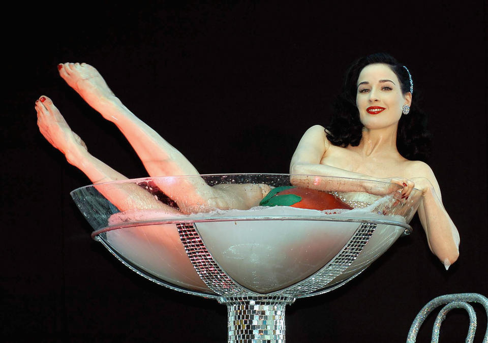 Dita Von Teese's famous champagne glass routine in 2005. (Photo: ShowBizIreland/Getty Images)