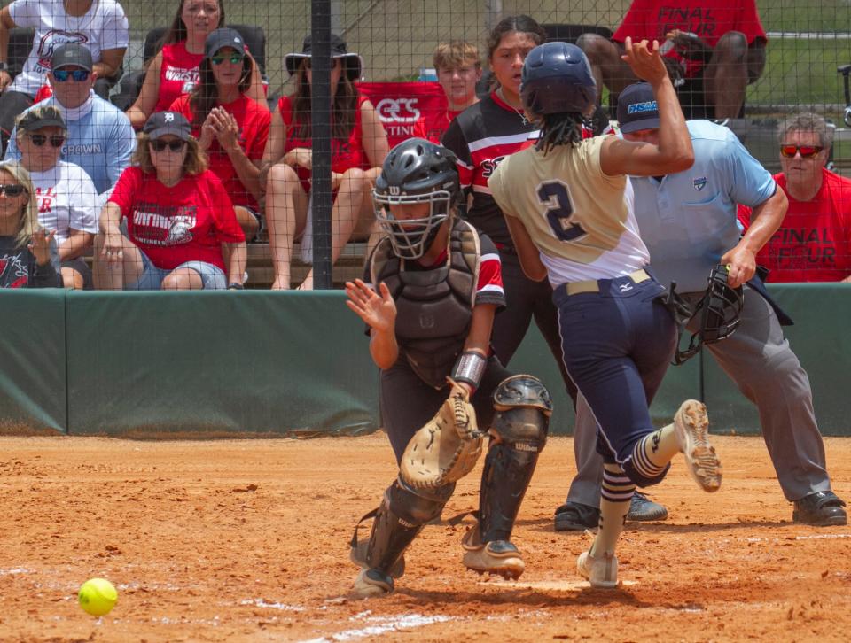 University Christian’s Jahliyah Robinson (2) beats the throw at home to score the go-ahead run in the fifth inning.