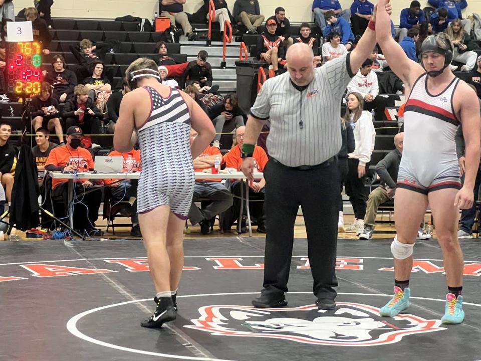 Noah Wenzel, left, the third Dakota wrestler to finish in second place at the Dvorak Wrestling Tournament on Sunday, Dec. 18, 2022, in Machesney Park, walks away dejected.