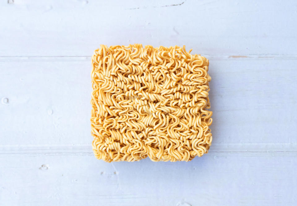 A package of ramen usually lists one serving as being just half of the "brick" of noodles. (Photo: Patcharanan Worrapatchareeroj via Getty Images)