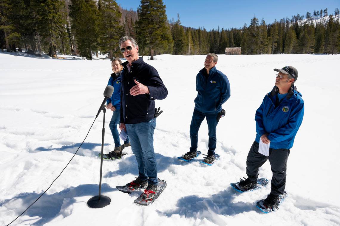 Gov. Gavin Newsom announces an updated California Water Plan with Department of Water Resources director Karla Nemeth, Natural Resources Secretary Wade Crowfoot and DWR water resources engineer Andrew Reising during the April snow survey at Phillips Station in El Dorado County on Tuesday. The measurement of the April water content in the snowpack is 110% of normal and is a key indicator for future water supply. Paul Kitagaki Jr./pkitagaki@sacbee.com