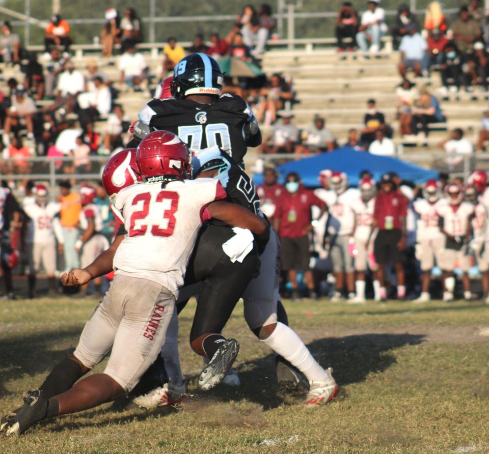 Raines defender Jahlil Richardson (23) tackles Ribault running back Bernard Brown III (34) in the backfield during the 52nd Northwest Classic high school football game on October 23, 2021. [Clayton Freeman/Florida Times-Union]