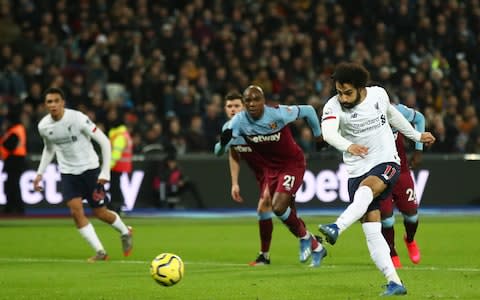 Mohamed Salah of Liverpool scores his team's first goal from the penalty spot during the Premier League match between West Ham United and Liverpool FC  - Credit: Getty Images