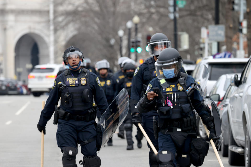 WASHINGTON, DC - JANUARY 06: Police officers in riot gear walks towards the U.S. Capitol as protesters enter the building on January 06, 2021 in Washington, DC. Trump supporters gathered in the nation's capital today to protest the ratification of President-elect Joe Biden's Electoral College victory over President Trump in the 2020 election. (Photo by Tasos Katopodis/Getty Images)