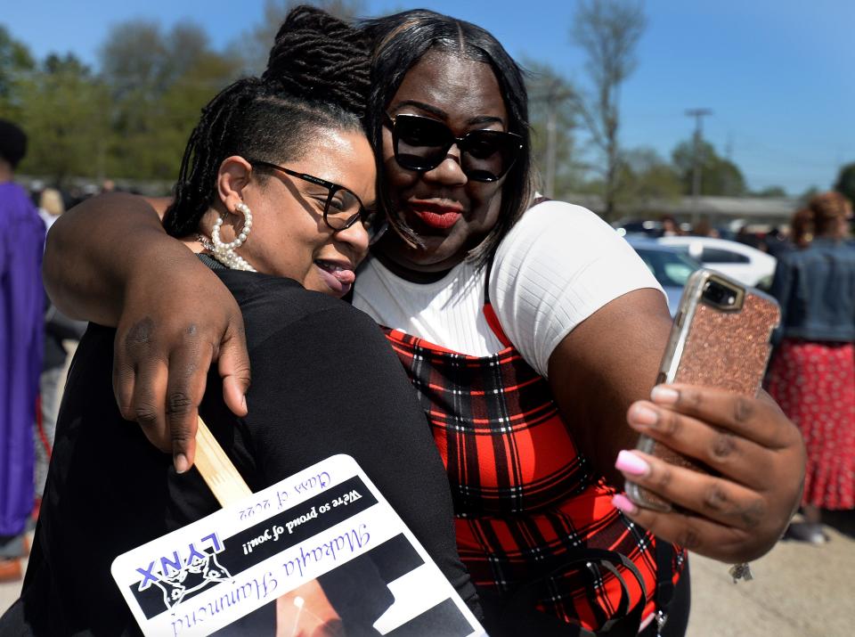 Lincoln College Alumnus Jaqujah Cooley, from Chicago  who graduated in 2020, takes a selfie with one of her former professors Monica Overton after the Lincoln College commencement Saturday May 7, 2022. [Thomas J. Turney/ The State Journal-Register]