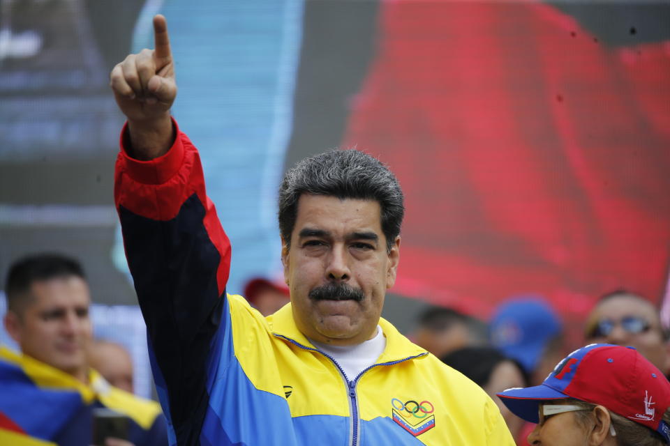 FILE - In this Aug. 10, 2019 file photo, Venezuela's President Nicolas Maduro lead a rally condemning the economic sanctions imposed by the administration of U.S. President Donald Trump on Venezuela, in Caracas, Venezuela. Maduro announced on Thursday, Aug. 29, that his delegates will start meeting again with the opposition to restart negotiations. (AP Photo/Ariana Cubillos, File)