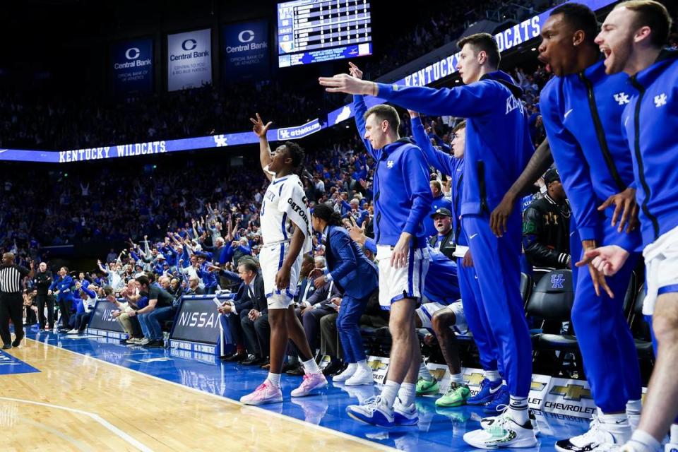 The Kentucky Wildcats bench celebrates a basket against Miami during Tuesday’s ACC/SEC Challenge game at Rupp Arena.