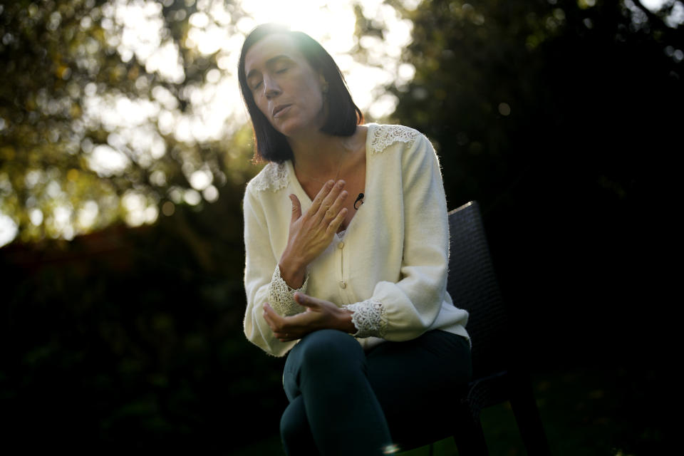 Ophelie Toulliou, sister of a victim of the Rio-Paris plane crash, speaks during an interview with The Associated Press in Sannois, outside Paris, Friday, Oct. 7, 2022. It was the worst plane crash in Air France history, killing people of 33 nationalities and having lasting impact. It led to changes in air safety regulations, how pilots are trained and the use of airspeed sensors. (AP Photo/Christophe Ena)