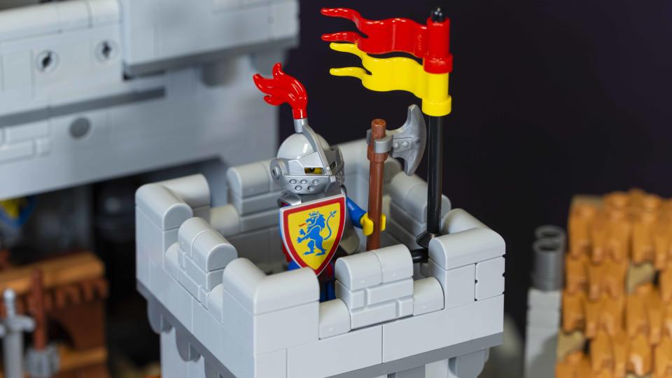 A knight stands guard atop a turret