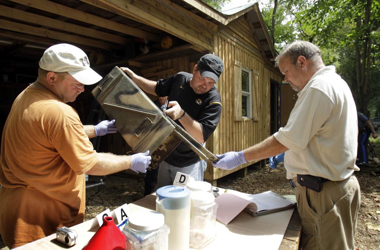 Police detectives sort through evidence after raiding a suspected meth lab. <a href="https://newsroom.ap.org/detail/UrbanMeth/62442edc986247c08ccfff109e7b07e0/photo?Query=meth%20AND%20rural&mediaType=photo&sortBy=creationdatetime:desc&dateRange=Anytime&totalCount=7&currentItemNo=6" rel="nofollow noopener" target="_blank" data-ylk="slk:AP Photo/Jeff Roberson;elm:context_link;itc:0;sec:content-canvas" class="link ">AP Photo/Jeff Roberson</a>