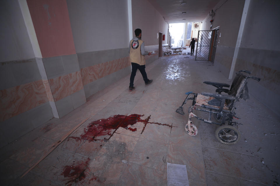 Blood is seen on a hospital floor in Atareb, a town in rural western Aleppo, Syria, Sunday, March 22, 2021. Artillery shells fired from government areas killed at least five civilians and wounded medical staff when they landad in front of the hospital. (AP Photo/Ghaith Alsayed)