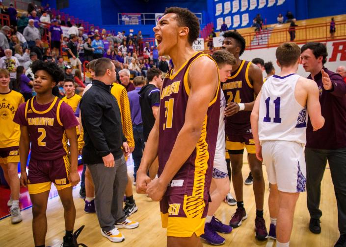 North&#39;s Bril Kante (31) celebrates winning the Bloomington North versus Bloomington South boys basketball sectional final at Martinsville High School on Saturday, March 5, 2022. North won the game 32-28.