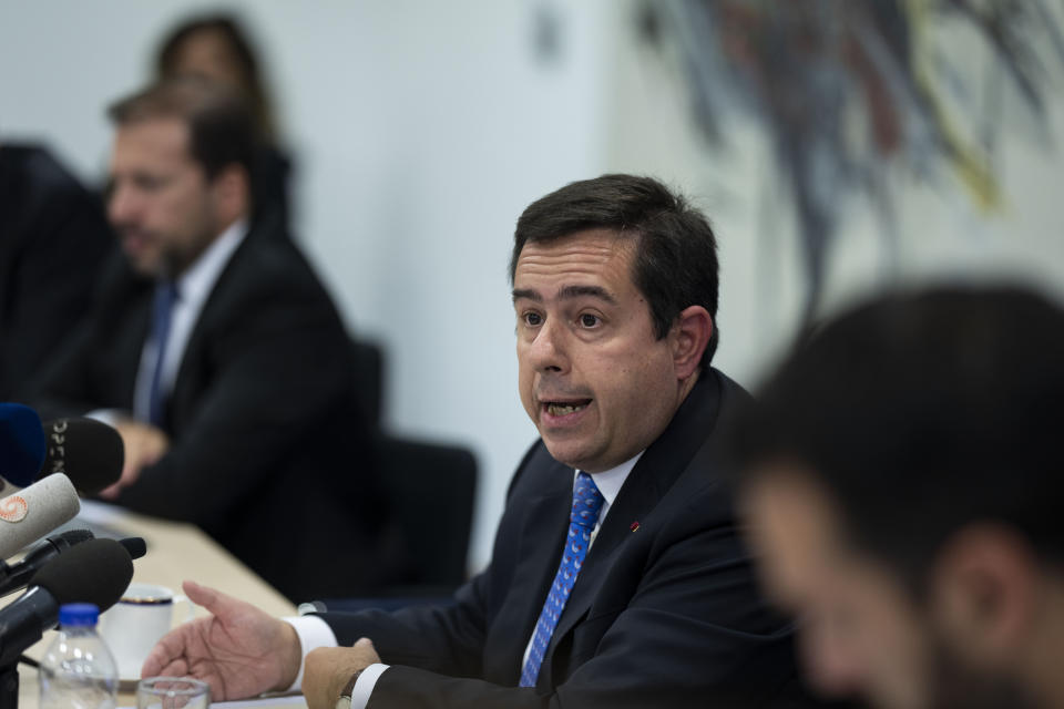 Greek Migration Minister Notis Mitarachi speaks to reporters during a news conference in Athens on Monday, Sept. 26, 2022. Mitarachi says Greece still considers neighbor Turkey to be a safe country for refugees despite recent allegations by the Greek government that Ankara has 'weaponized' migration for political purposes. (AP Photo/Petros Giannakouris)