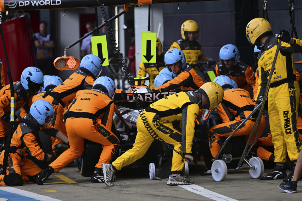 McLaren driver Lando Norris of Britain gets a pit service during the British Formula One Grand Prix race at the Silverstone racetrack, Silverstone, England, Sunday, July 9, 2023. (Christian Bruna/Pool photo via AP)