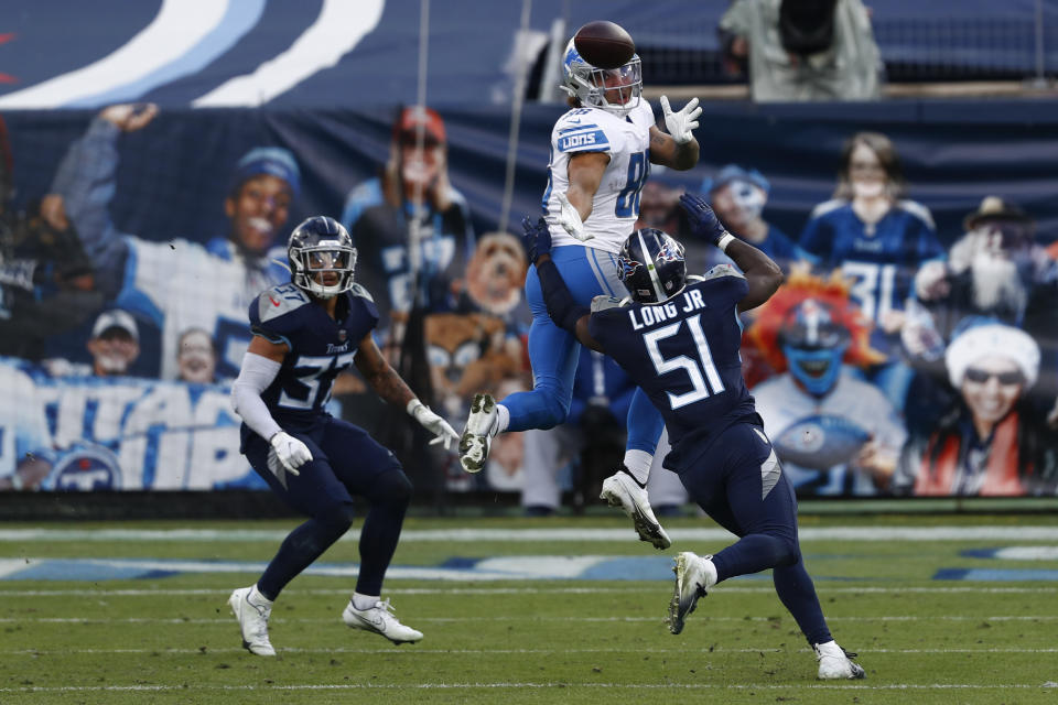Detroit Lions tight end Hunter Bryant catches a pass over Tennessee Titans linebacker David Long during the second half of an NFL football game Sunday, Dec. 20, 2020, in Nashville, N.C. (AP Photo/Wade Payne)