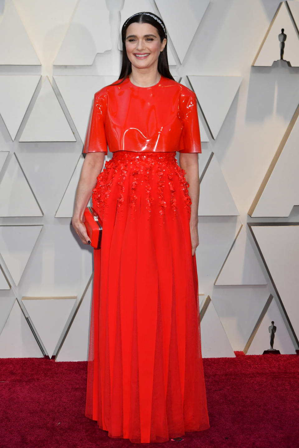 <p>“The Favourite” star and nominee for Best Supporting Actress wore a bright red gown with delicate flower detailing by Givenchy. <em>[Photo: Getty]</em> </p>