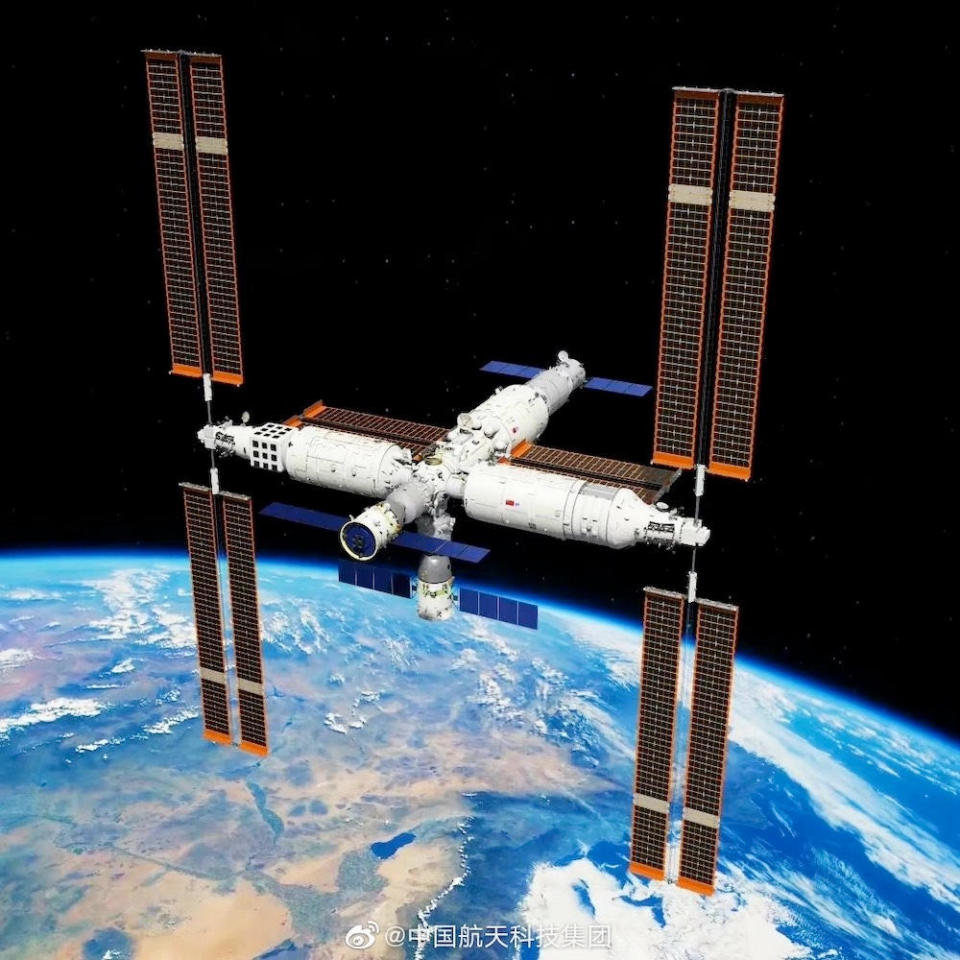 An artist's impression of the Tiangong space station with two Shenzhou crew ships and an automated cargo carrier attached to docking ports. / Credit: China Aerospace Science and Technology Corporation