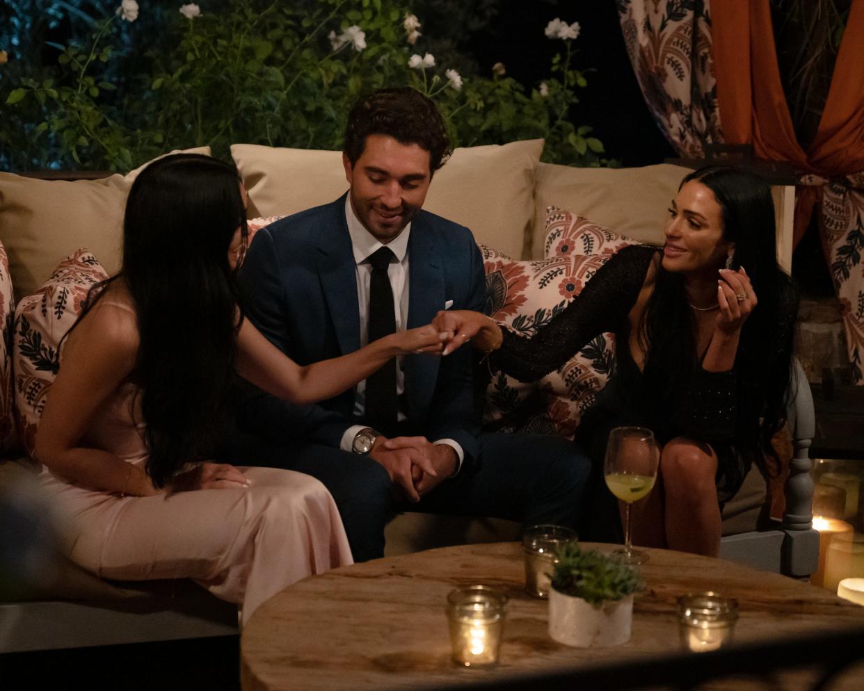 Sisters Allison Hollinger (left) and Lauren Hollinger have a chat with Bachelor Joey Graziadei. The two Philadelphia women planned to keep their relation a secret on the first night, but they decided couldn’t keep their lips zipped and told everyone. Both got roses.