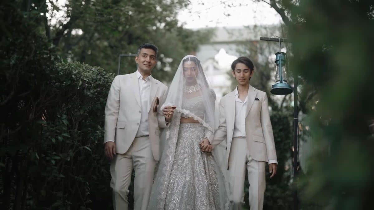 Azan (right) walks his mother Mahira Khan down the aisle.   (Mahira Khan)