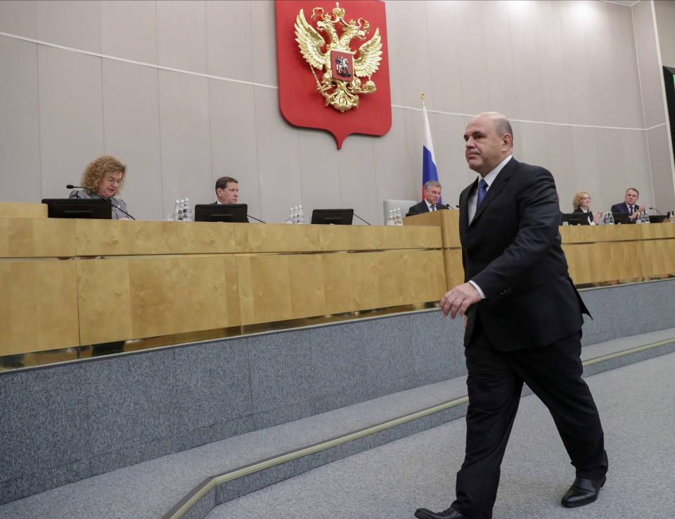 In this handout photo provided by The State Duma, The Federal Assembly of The Russian Federation, Russian Tax Service chief Mikhail Mishustin, who was nominated to replace Medvedev, leaves a podium after his speech at the State Duma, the Lower House of the Russian Parliament in Moscow, Russia, Thursday, Jan. 16, 2020. 53-year-old Mishustin, the longtime chief of Russia's tax service, was tapped for the post by President Vladimir Putin. The lower house of Russia's parliament, the Duma, quickly appointed Mishustin as prime minister on Thursday. (The State Duma, The Federal Assembly of The Russian Federation via AP)