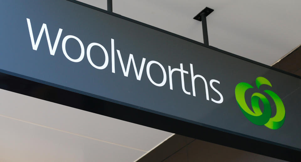 Sign at the entrance of a Woolworths store.