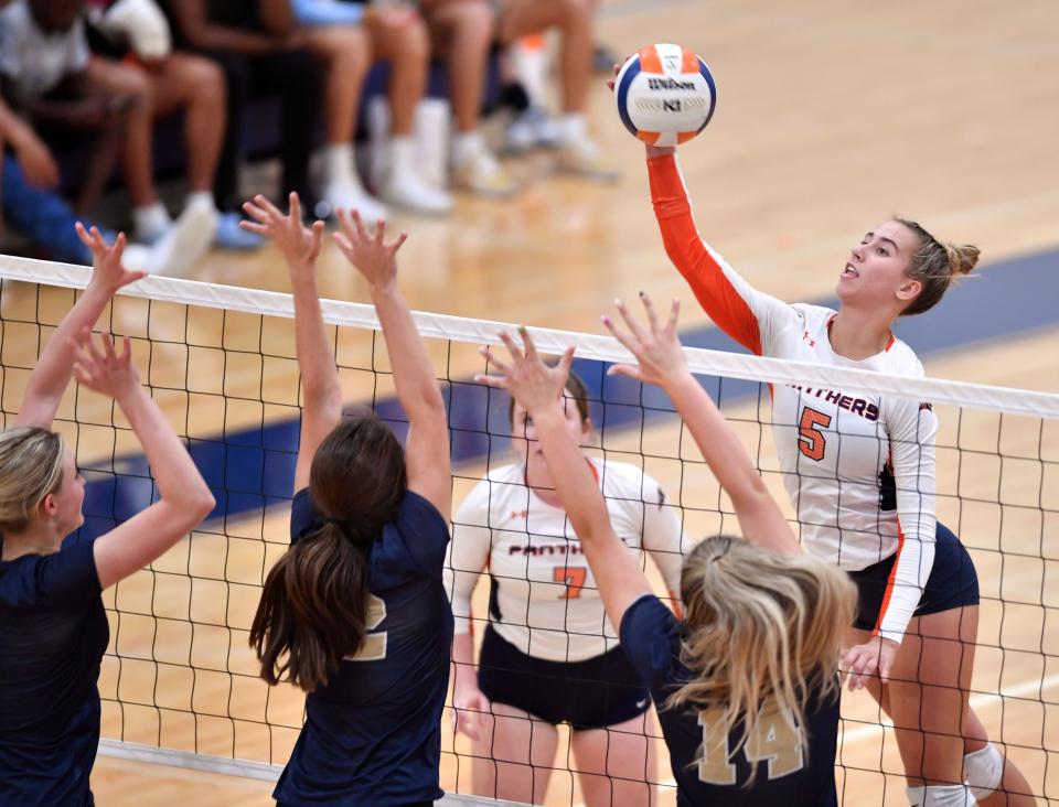 Bradenton Christian's Emma Laade (5), shown here spiking the ball over Southwest Florida Christian Academy defenders, had 393 kills and 274 digs for the Panthers this season.