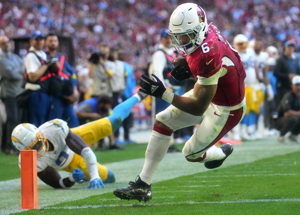 Nov 27, 2022; Glendale, AZ, USA; Arizona Cardinals running back James Conner (6) runs in a touchdown against the Los Angeles Chargers at State Farm Stadium. Mandatory Credit: Joe Rondone-Arizona Republic