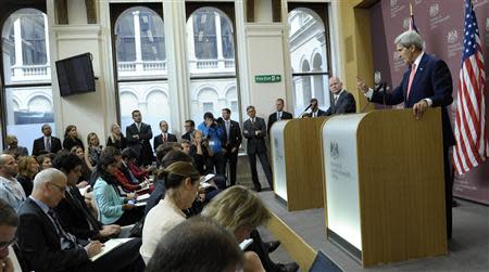 U.S. Secretary of State John Kerry (R) speaks as Britain's Foreign Minister William Hague (2nd R) listens during a news conference at the Foreign and Commonwealth Office in London September 9, 2013. REUTERS/Susan Walsh/Pool