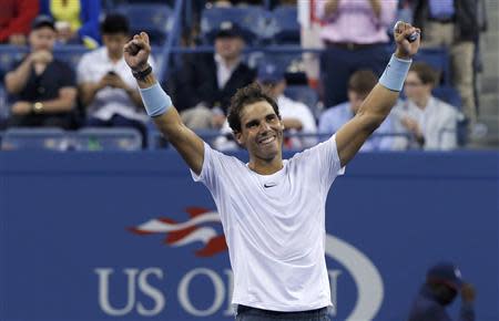 Rafael Nadal of Spain celebrates after defeating Richard Gasquet of France in their men's semi-final match at the U.S. Open tennis championships in New York September 7, 2013. REUTERS/Kena Betancur