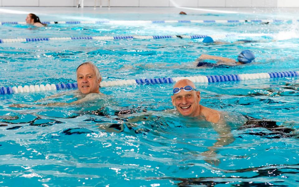 The Telegraph's Jim White swimming with Olympian, Duncan Goodhew on the first day of reopening of indoor swimming facilities, at the Clissold Leisure Centre, Stoke Newington, London. - Geoff Pugh for the Telegraph
