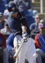 Milwaukee Brewers' Ryan Braun hits a single during the fifth inning of an exhibition spring training baseball game against the Chicago Cubs Monday, March 3, 2014, in Phoenix. (AP Photo/Morry Gash)