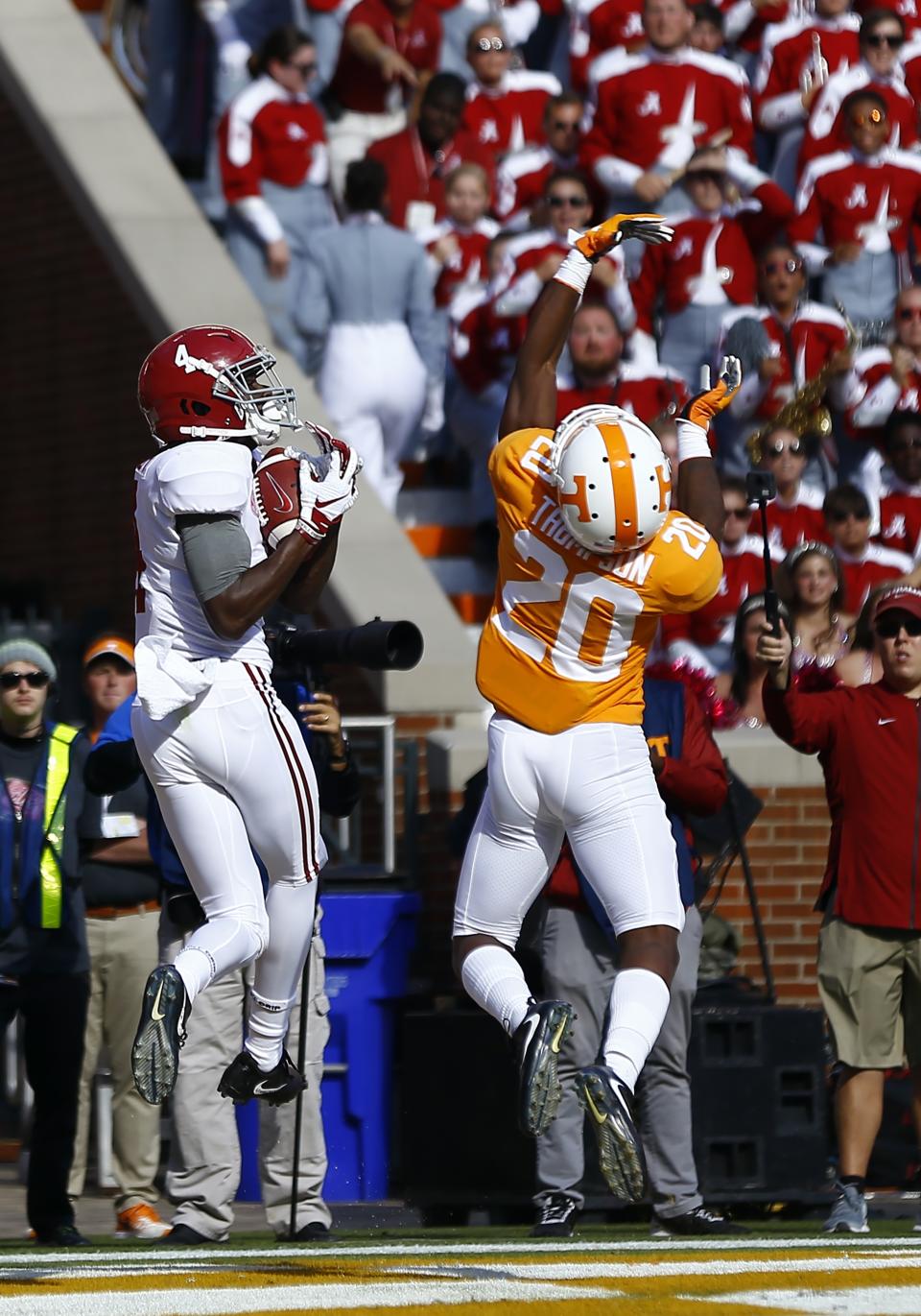 Alabama wide receiver Jerry Jeudy (4) catches a pass for a touchdown over Tennessee defensive back Bryce Thompson (20) in the first half of an NCAA college football game Saturday, Oct. 20, 2018, in Knoxville, Tenn. (AP Photo/Wade Payne)