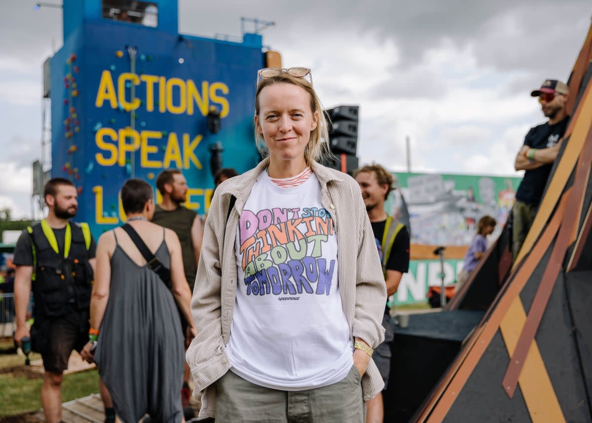 Festival organiser Emily Eavis wearing a Greenpeace ‘Don’t Stop Thinking About Tomorrow’ T-shirt at Glastonbury 2023 (Marie Jacquemin/Greenpeace)