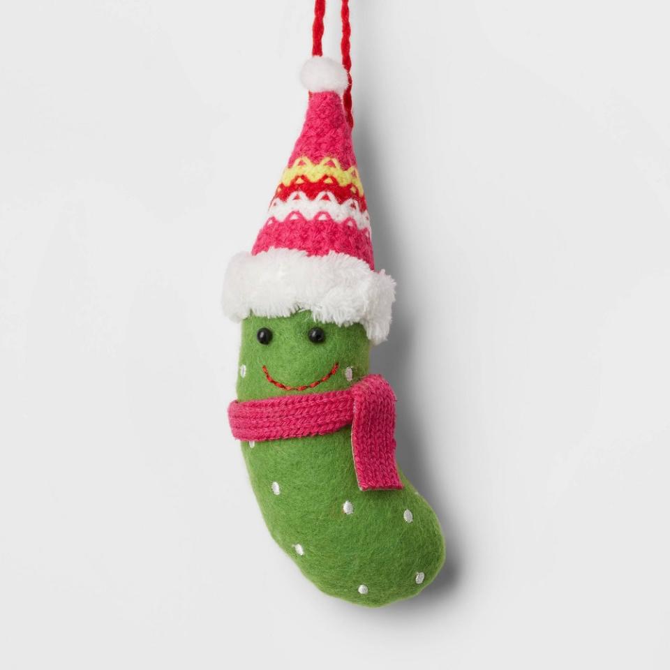 <p><a href="https://go.redirectingat.com?id=74968X1596630&url=https%3A%2F%2Fwww.target.com%2Fp%2Ffelt-pickle-wearing-knit-hat-and-scarf-christmas-tree-ornament-green-pink-wondershop-8482%2F-%2FA-87818501&sref=https%3A%2F%2Fwww.countryliving.com%2Fhome-design%2Fdecorating-ideas%2Fg5053%2Fpickle-ornament-meaning%2F" rel="nofollow noopener" target="_blank" data-ylk="slk:Shop Now;elm:context_link;itc:0;sec:content-canvas" class="link ">Shop Now</a></p><p>Felt Pickle Ornament </p><p>target.com</p><p>$3.00</p>