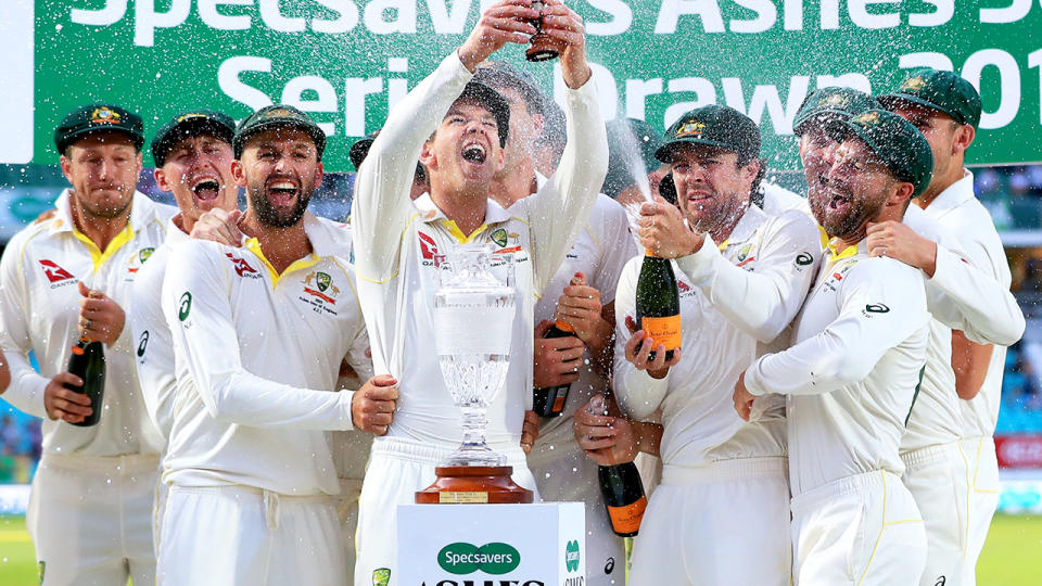 Tim Paine, pictured here celebrating with the Ashes urn.