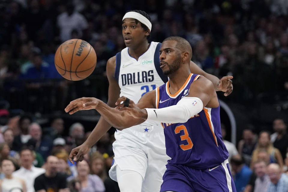 Phoenix Suns guard Chris Paul (3) passes the ball in front of Dallas Mavericks guard Frank Ntilikina (21) during the first half of Game 3 of an NBA basketball second-round playoff series, Friday, May 6, 2022, in Dallas. (AP Photo/Tony Gutierrez)