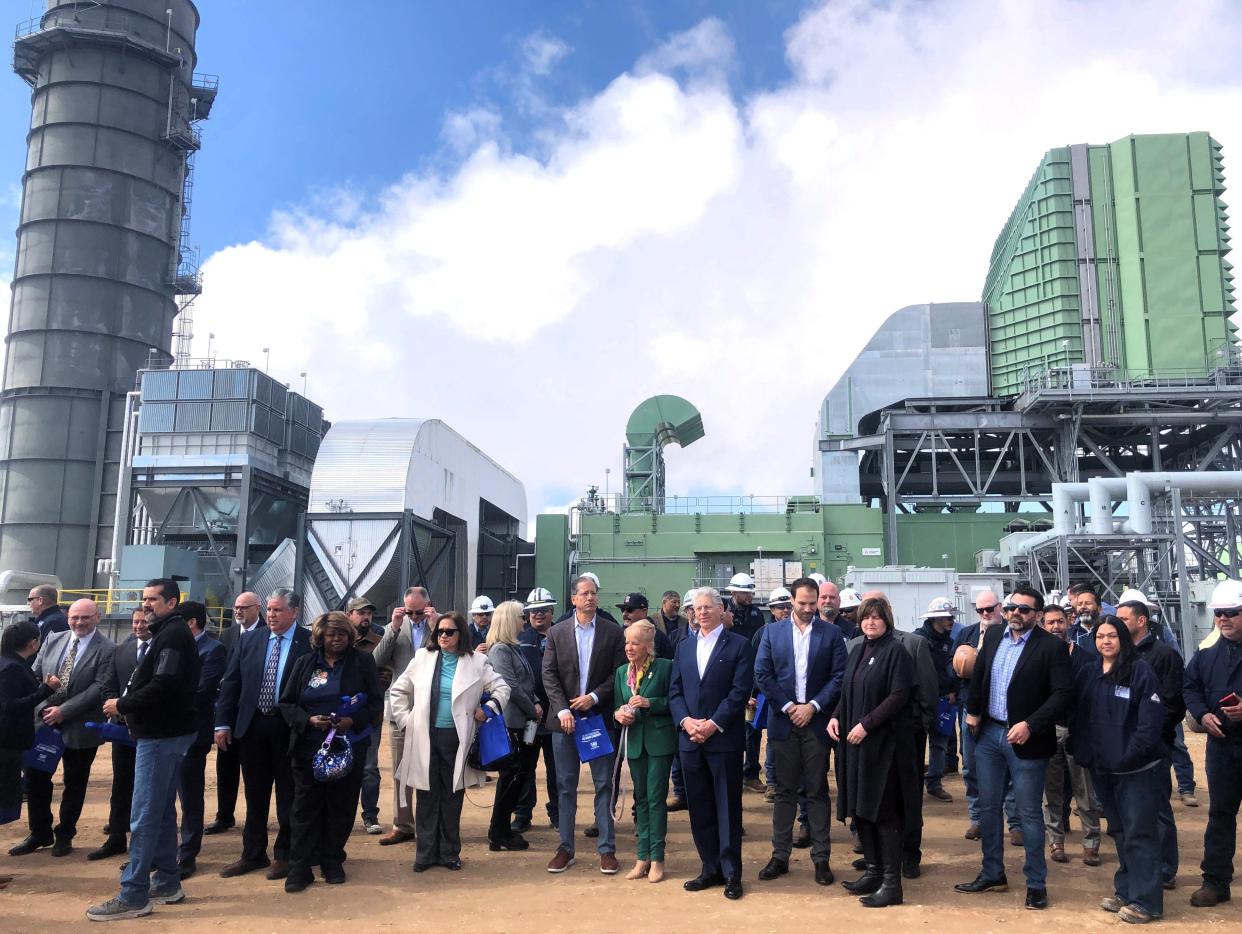 El Paso Electric employees, company board members, and others pose for a large group photo Feb. 29 in front of the building housing the new, 228-megawatt generator at the Newman power plant in far Northeast El Paso.