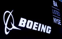 The Boeing logo is displayed on a screen at the NYSE in New York