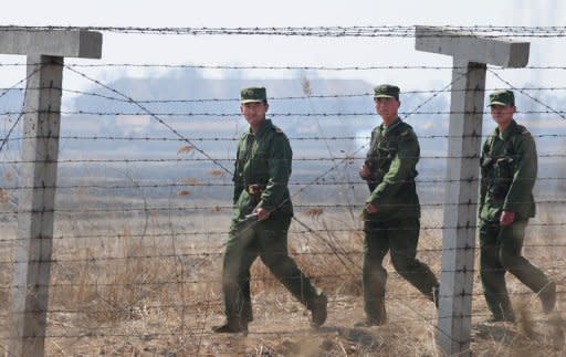 File photo shows Chinese soldiers patrolling the North Korea-China border near Dandong, in China's northeast Liaoning province. China has stopped sending fleeing North Koreans back across the border, in retaliation for Pyongyang failing to consult its ally over last week's rocket launch, a Japanese report said Wednesday