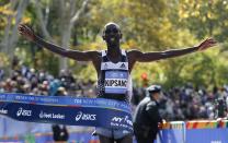 Wilson Kipsang of Kenya crosses the finish line to win the men's professional division of the 2014 New York City Marathon in Central Park in Manhattan, November 2, 2014. Kipsang of Kenya won the men's race in the New York City Marathon on Sunday with a final sprint to the finish in an unofficial two hours 10 minutes 59 seconds. REUTERS/Mike Segar (UNITED STATES - Tags: SPORT ATHLETICS)