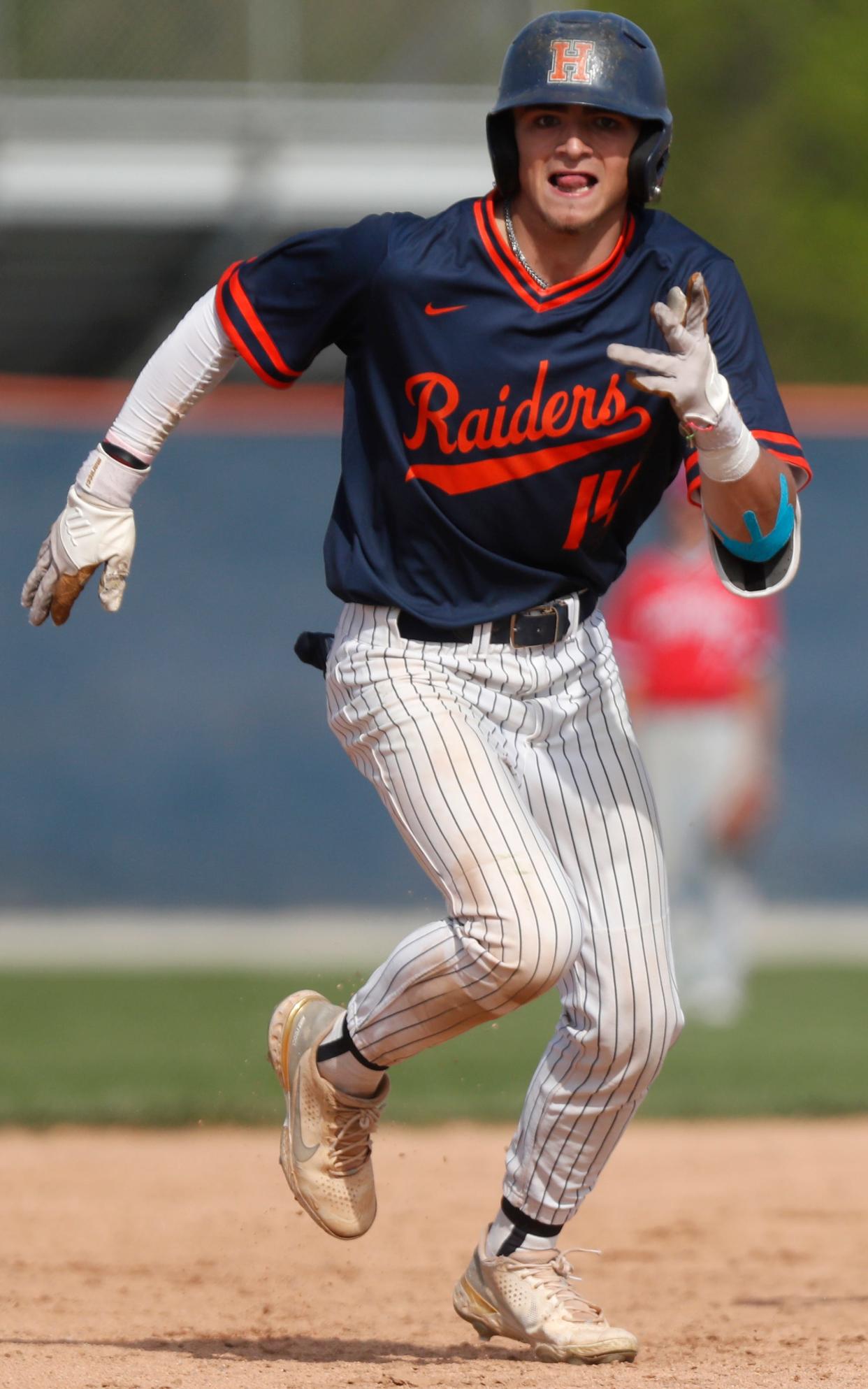 Harrison Raiders Drew McTagertt (14) runs to third base during the IHSAA North Central Conference baseball tournament game against the Kokomo Wildkats, Saturday, May 6, 2023, at Harrison High School in West Lafayette, Ind. Harrison won 6-2.